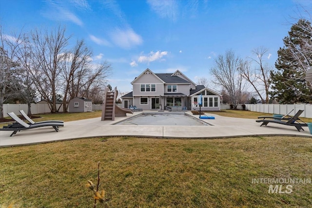 rear view of house featuring a patio area, fence, and stairway