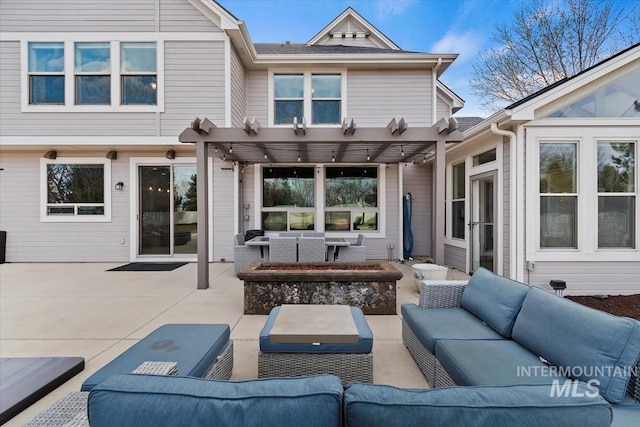 rear view of house featuring outdoor lounge area, a patio, and a pergola