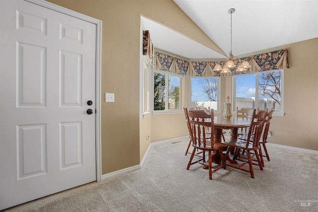 72 Pelican Dr, Rupert, ID 83350 - dining room with baseboards, carpet flooring, a notable chandelier, and vaulted ceiling