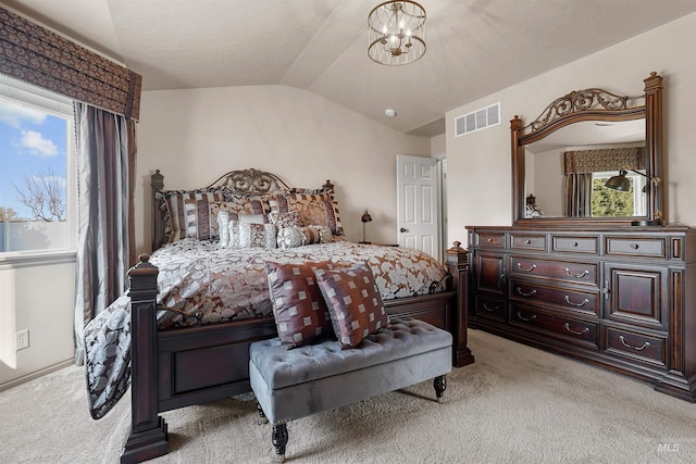 72 Pelican Dr, Rupert, ID 83350 - bedroom with light carpet, a notable chandelier, vaulted ceiling, and visible vents