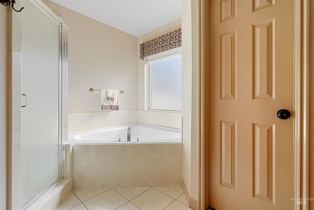 72 Pelican Dr, Rupert, ID 83350 - full bathroom featuring tile patterned floors, a garden tub, and a stall shower