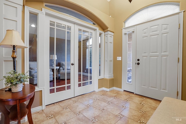 72 Pelican Dr, Rupert, ID 83350 - foyer entrance featuring french doors, baseboards, and stone tile floors