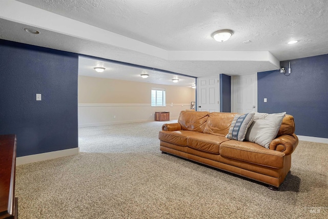 72 Pelican Dr, Rupert, ID 83350 - living room featuring a textured ceiling, a textured wall, baseboards, and carpet