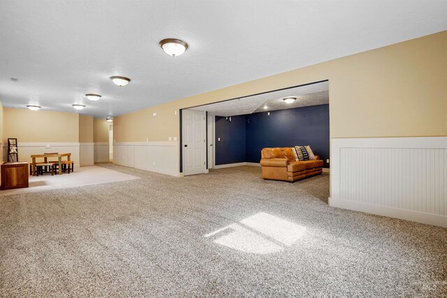 72 Pelican Dr, Rupert, ID 83350 - finished basement with a textured ceiling, carpet, and a wainscoted wall