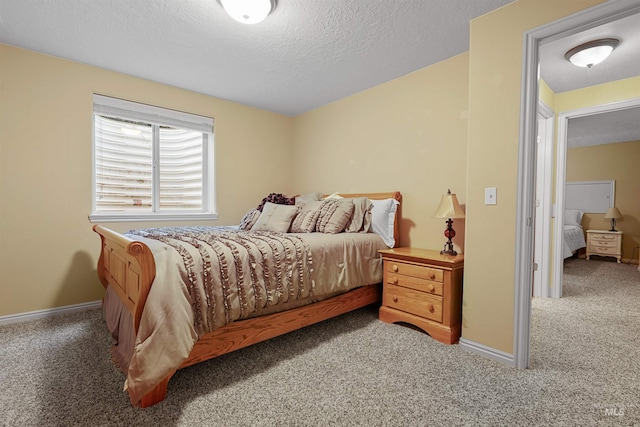 72 Pelican Dr, Rupert, ID 83350 - bedroom featuring baseboards, carpet, and a textured ceiling