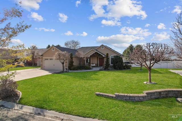 72 Pelican Dr, Rupert, ID 83350 - view of front of property with a front yard, driveway, a garage, and stucco siding