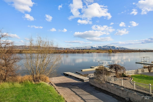 72 Pelican Dr, Rupert, ID 83350 - view of dock featuring fence and a water and mountain view