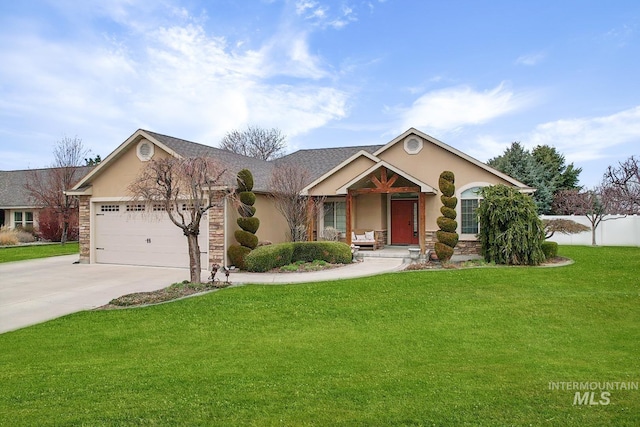 72 Pelican Dr, Rupert, ID 83350 - view of front of house featuring stucco siding, concrete driveway, an attached garage, a front lawn, and stone siding