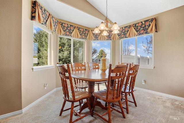 72 Pelican Dr, Rupert, ID 83350 - carpeted dining room with baseboards and a notable chandelier