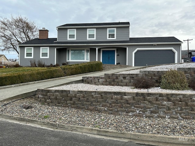 front of property with a garage