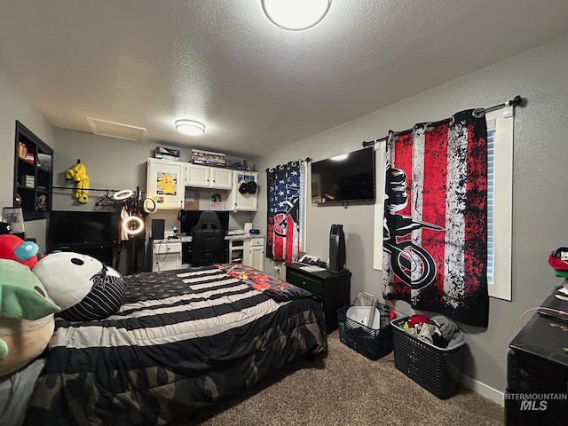 carpeted bedroom featuring a textured ceiling