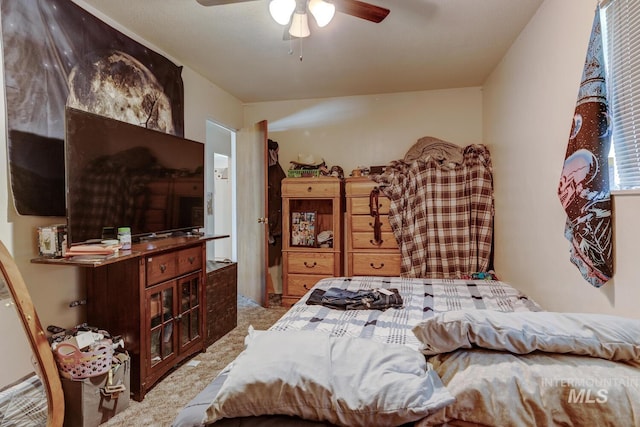 bedroom featuring ceiling fan and light colored carpet