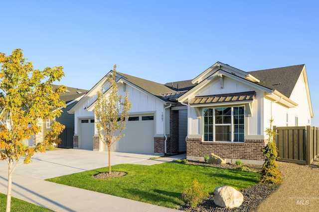 view of front of house with an attached garage, brick siding, fence, concrete driveway, and board and batten siding