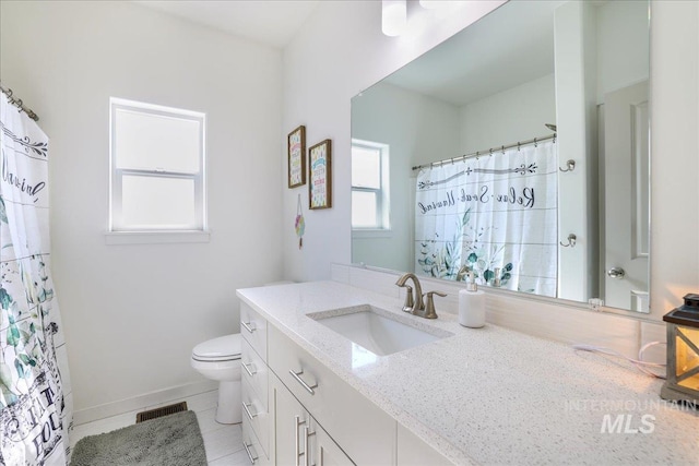 209 W 13th Ave, Jerome, ID 83338 - full bathroom with vanity, toilet, tile patterned flooring, baseboards, and curtained shower