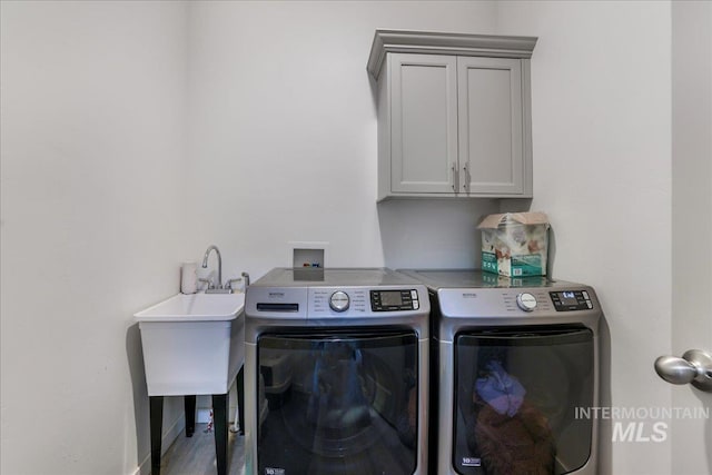 209 W 13th Ave, Jerome, ID 83338 - laundry room with separate washer and dryer, baseboards, and cabinet space