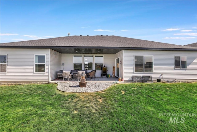 209 W 13th Ave, Jerome, ID 83338 - back of house with outdoor lounge area, a patio, and a yard