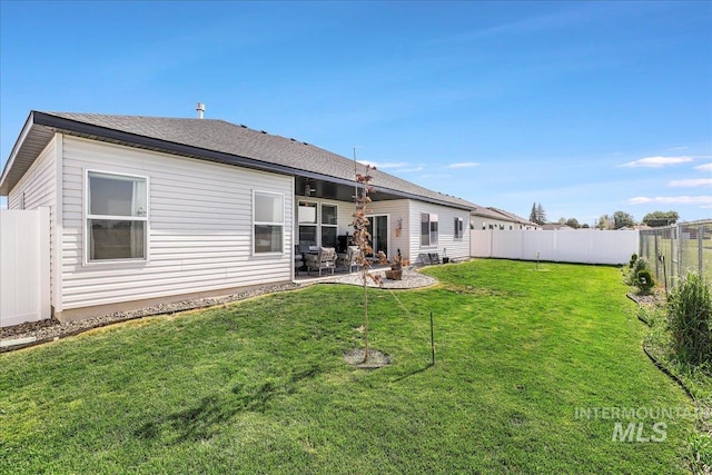209 W 13th Ave, Jerome, ID 83338 - back of property featuring a patio area