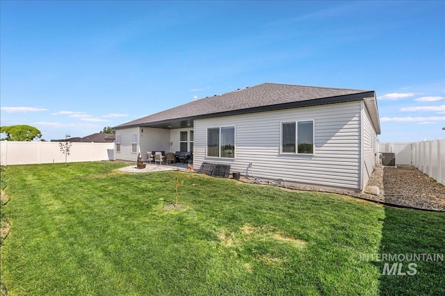 209 W 13th Ave, Jerome, ID 83338 - back of house featuring a patio area