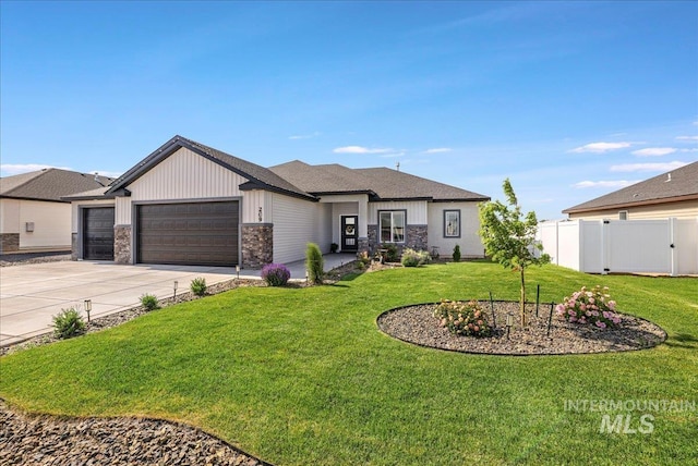 209 W 13th Ave, Jerome, ID 83338 - view of front of home with a garage, concrete driveway, stone siding, and board and batten siding