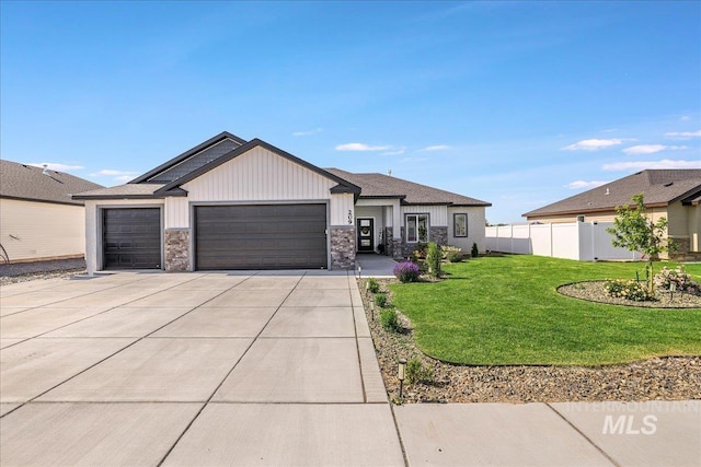 209 W 13th Ave, Jerome, ID 83338 - view of front of property with a garage, concrete driveway, and board and batten siding