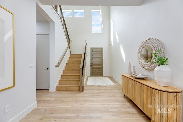 foyer entrance with light hardwood / wood-style floors