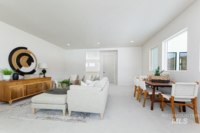 living room featuring light carpet