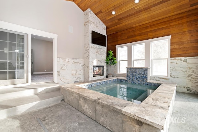 view of pool featuring an indoor in ground hot tub