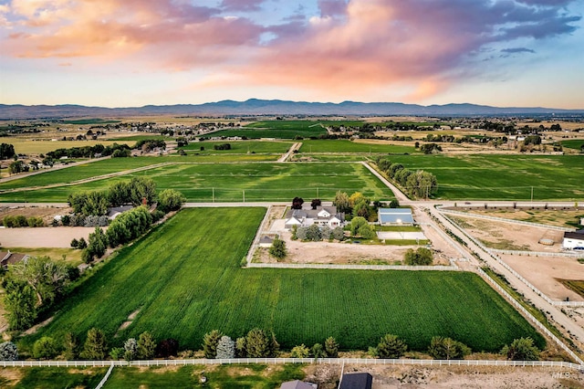 birds eye view of property with a mountain view and a rural view