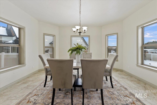 dining space featuring a chandelier