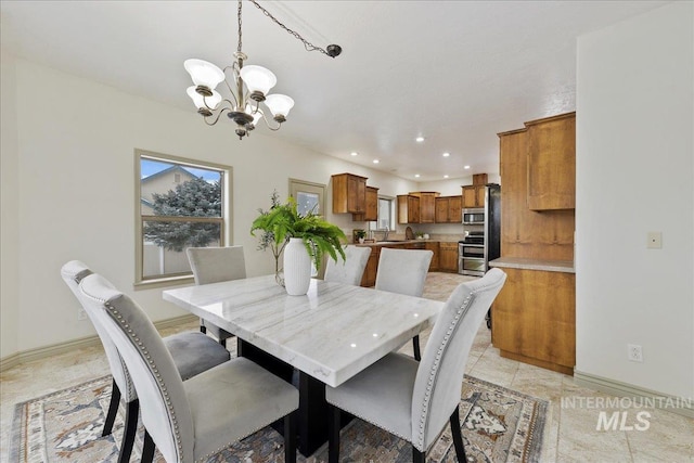 dining space with a notable chandelier