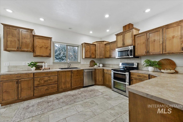 kitchen with sink and appliances with stainless steel finishes