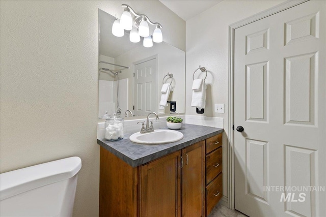 bathroom with vanity and toilet