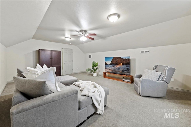 carpeted living room with vaulted ceiling and ceiling fan