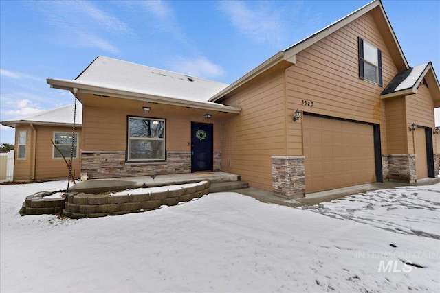 view of front of home with a garage and covered porch