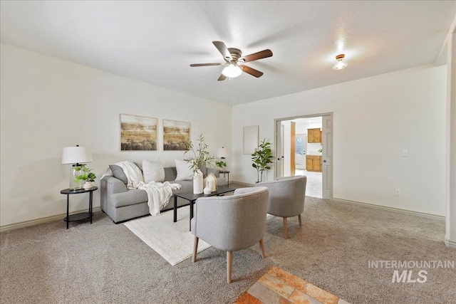 living room with light carpet and ceiling fan