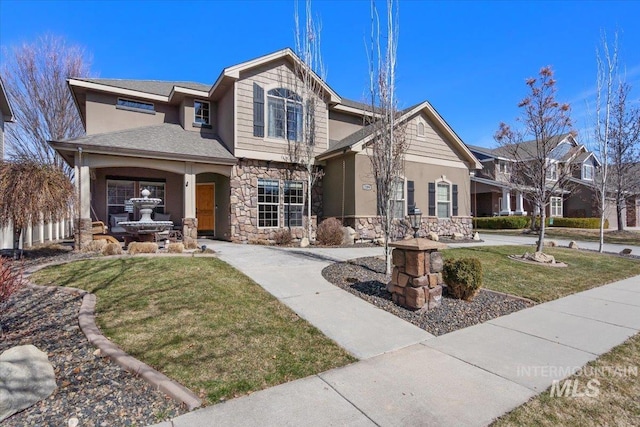 view of front of house with stone siding, stucco siding, and a front lawn