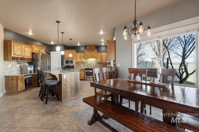 dining area featuring light tile patterned floors, recessed lighting, and an inviting chandelier