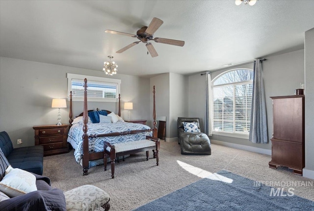 bedroom with multiple windows, baseboards, and carpet