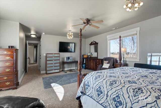 carpeted bedroom featuring visible vents, baseboards, and an inviting chandelier