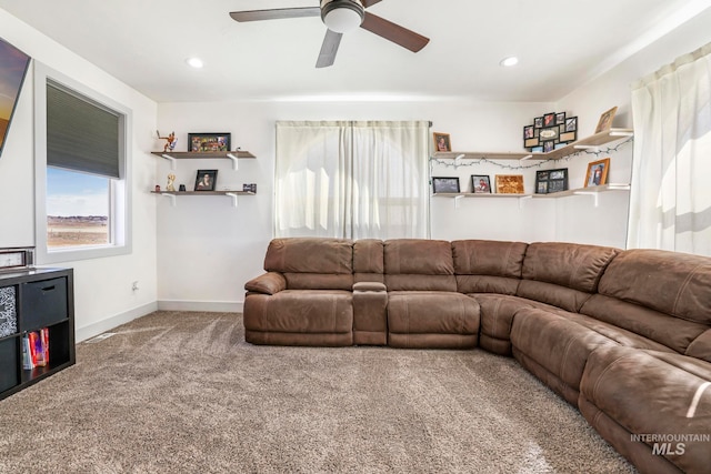 living room featuring ceiling fan and carpet floors