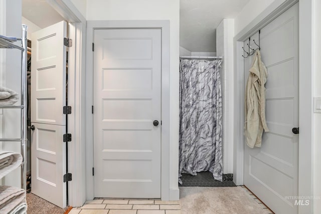 bathroom featuring tile floors