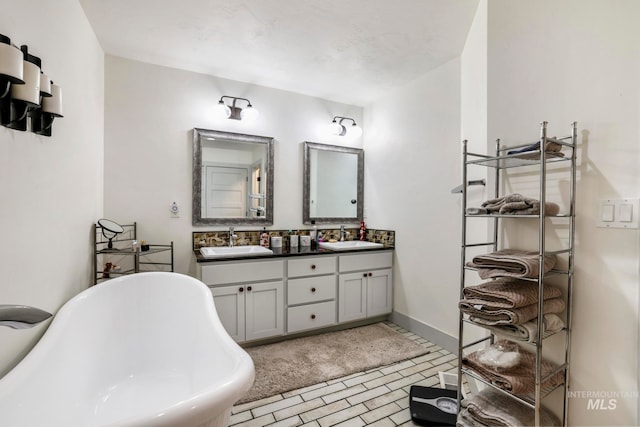 bathroom with dual bowl vanity, tile floors, and a tub