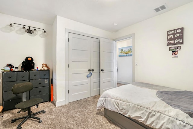 bedroom featuring a closet and light colored carpet