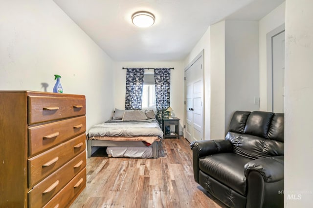 bedroom with light wood-type flooring