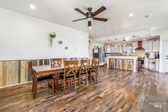 dining area featuring hardwood / wood-style floors and ceiling fan