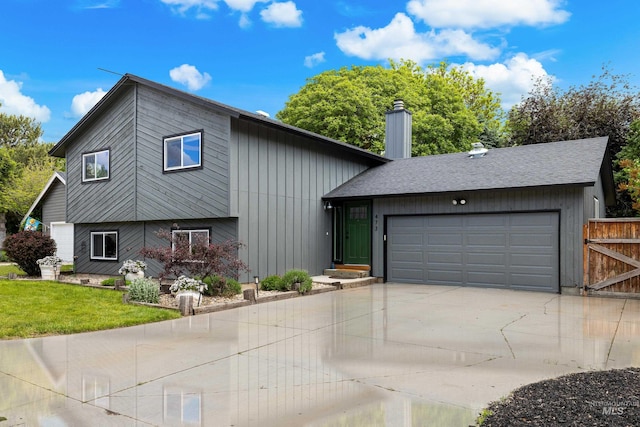 473 E Ranch Dr, Eagle, ID 83616 - view of front of property with a garage, concrete driveway, and a chimney