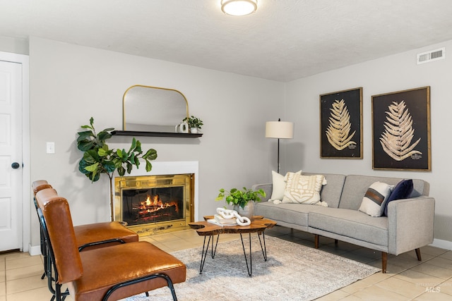 473 E Ranch Dr, Eagle, ID 83616 - tiled living area with a glass covered fireplace and baseboards