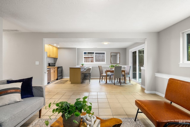 473 E Ranch Dr, Eagle, ID 83616 - living area featuring healthy amount of natural light, light tile patterned floors, and baseboards