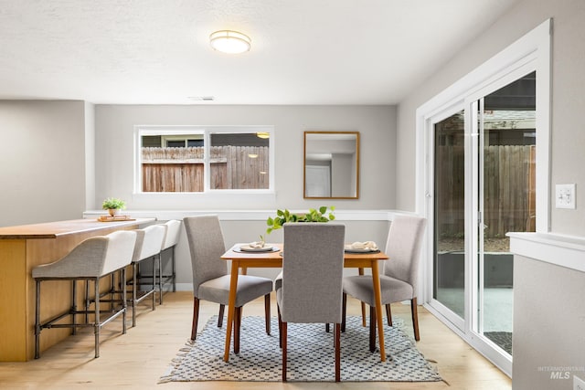 473 E Ranch Dr, Eagle, ID 83616 - dining space with plenty of natural light and light wood-style floors