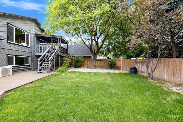 473 E Ranch Dr, Eagle, ID 83616 - view of yard featuring a wooden deck, stairway, and a cooling unit